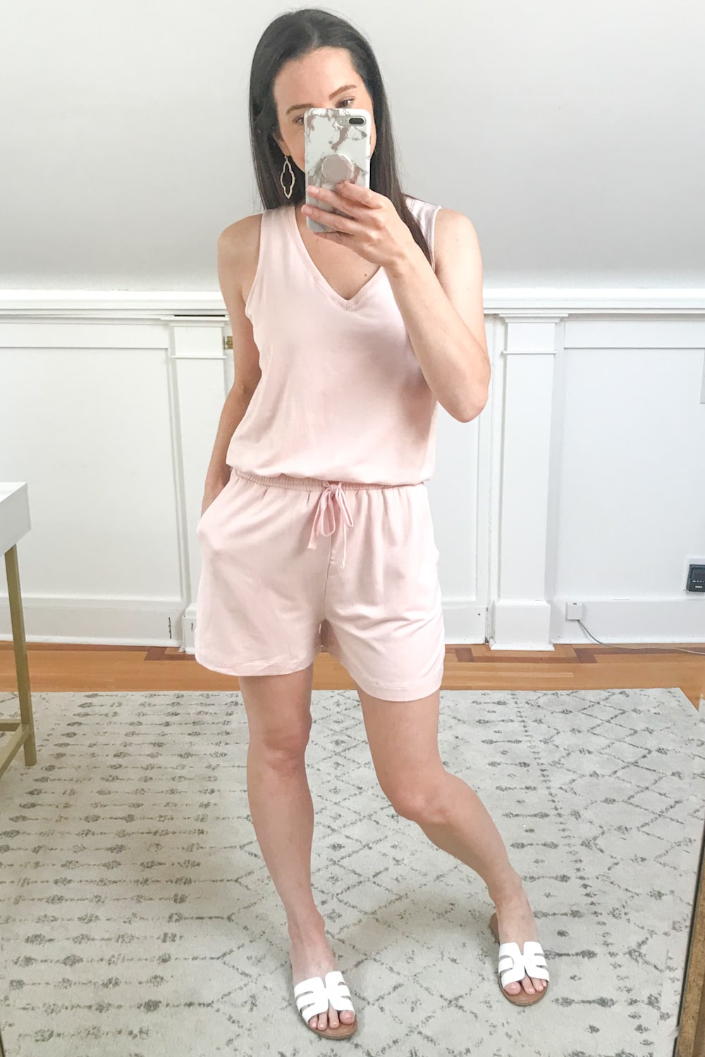 Affordable fashion blogger Stephanie Ziajka tries on a pink terry romper for her honeymoon on Diary of a Debutante