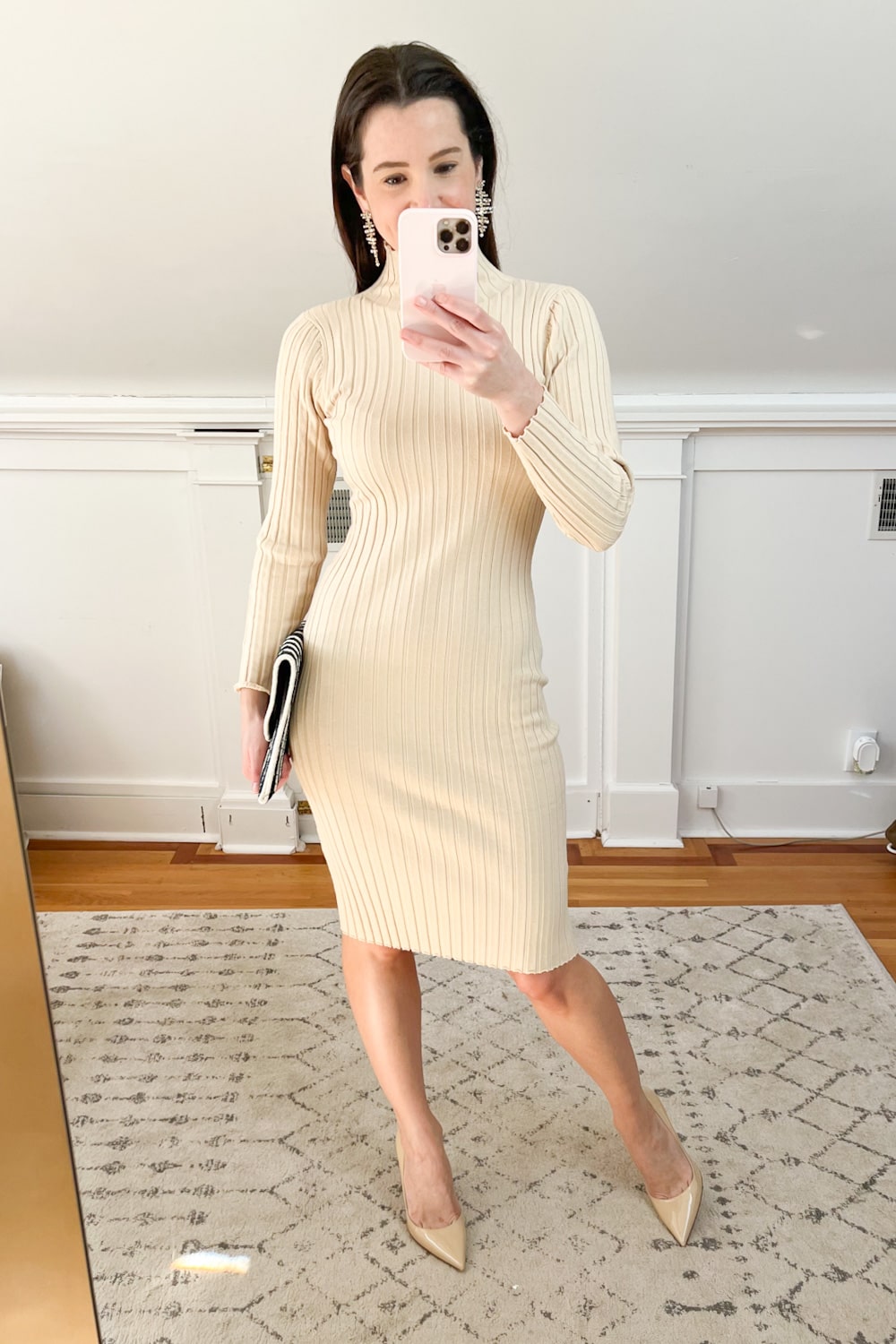 Affordable fashion blogger Stephanie Ziajka styles a khaki long sleeve Christmas dress with M.Gemi pumps and Kendra Scott Madelyn statement earrings on Diary of a Debutante