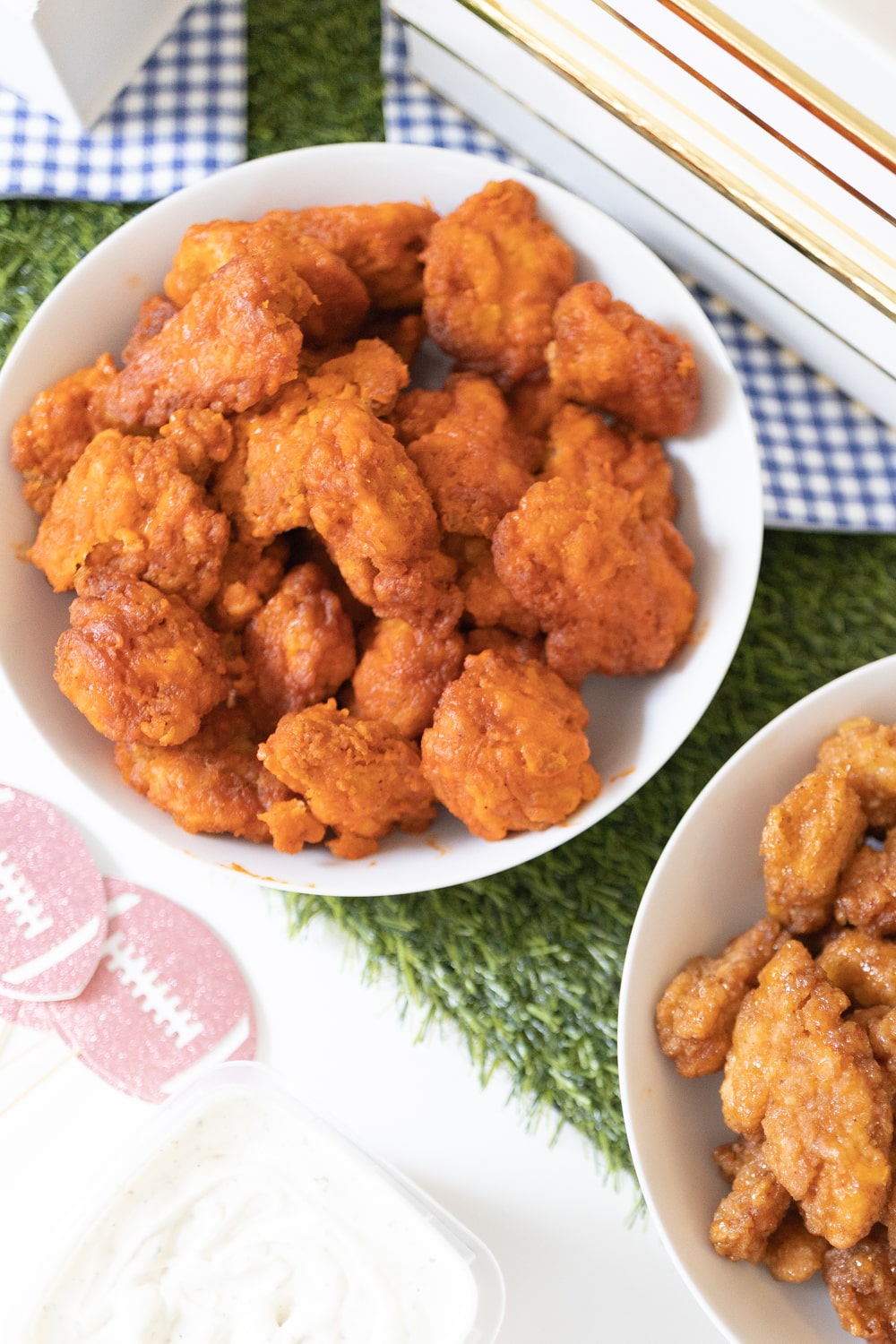 Hy-Vee boneless buffalo wings as part of a game day snack spread created by blogger Stephanie Ziajka on Diary of a Debutante