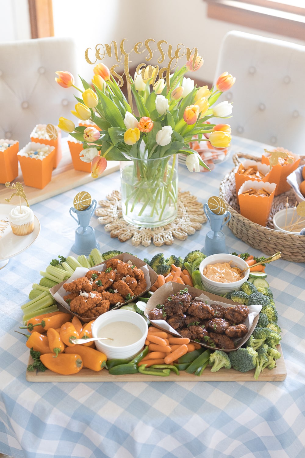 Pretty game day snack table prepared for a March Madness party by southern lifestyle blogger Stephanie Ziajka on Diary of a Debutante