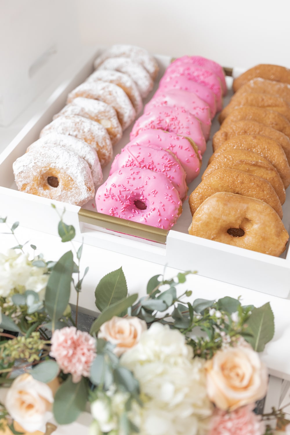 Powdered, glazed, and pink frosted donuts from Hy-Vee's bakery on Diary of a Debutante