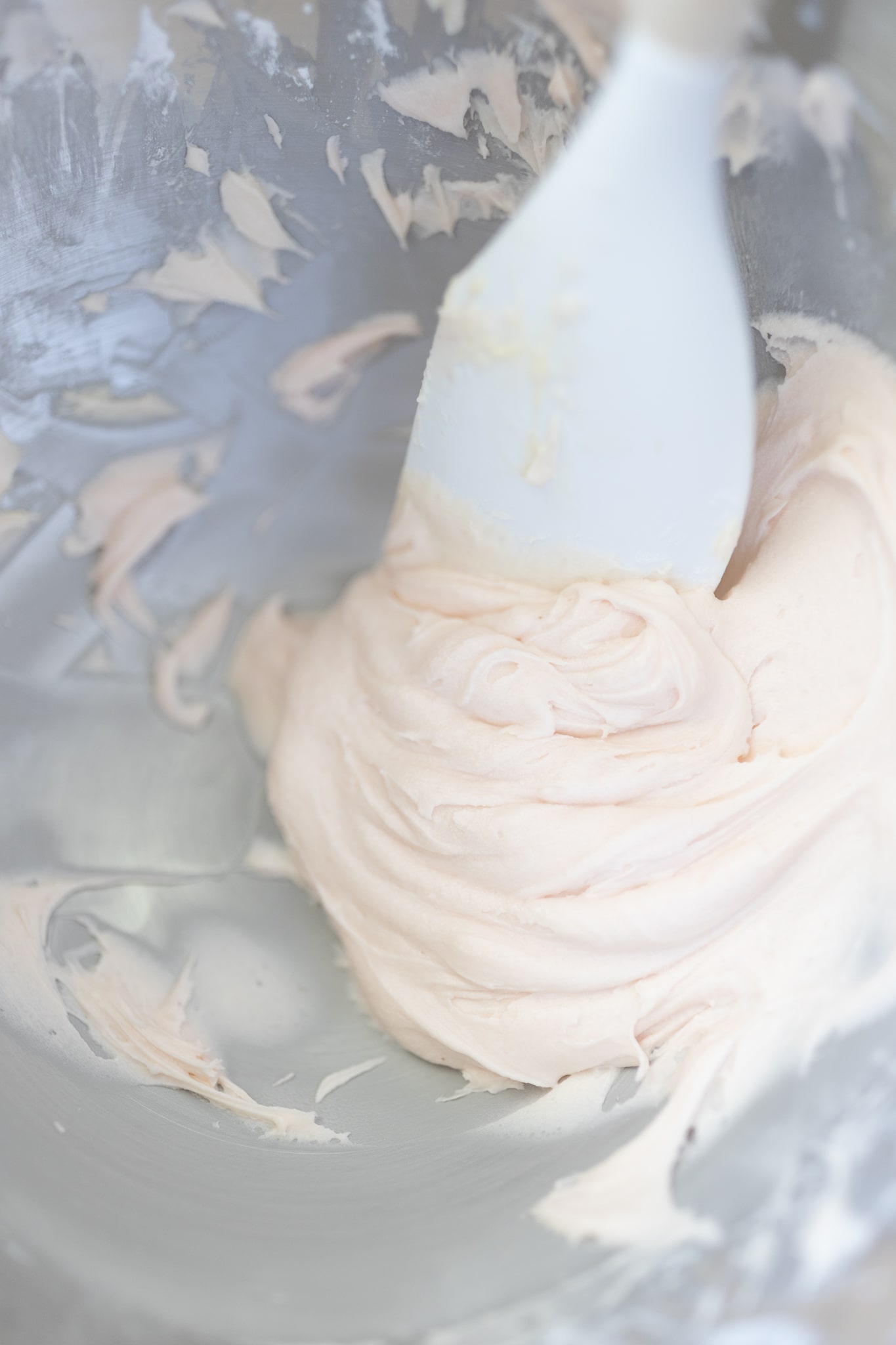 Blogger Stephanie Ziajka shows how to make pink buttercream frosting on Diary of a Debutante