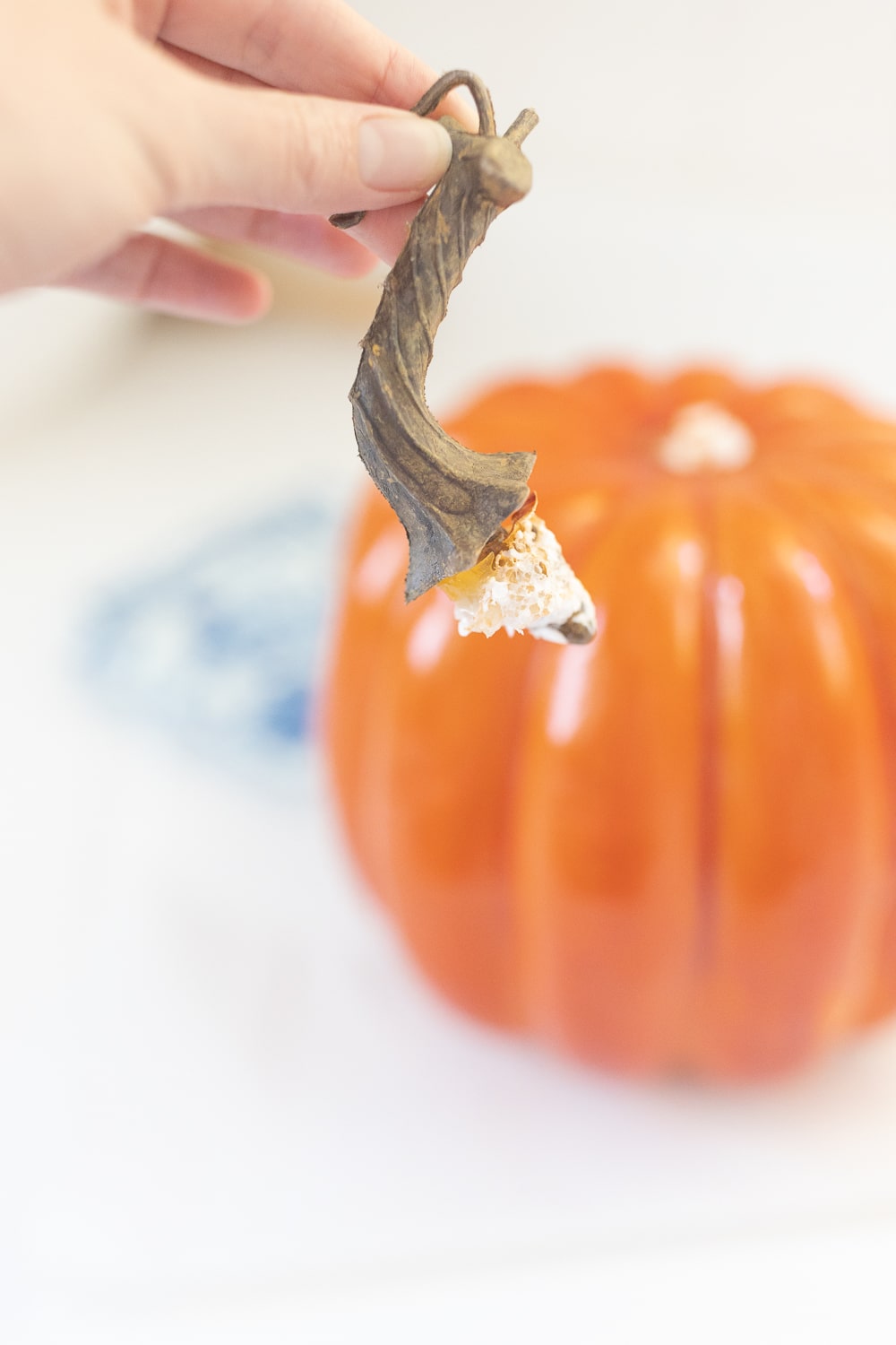 Step one of blogger Stephanie Ziajka's blue and white decoupage pumpkin tutorial on Diary of a Debutante