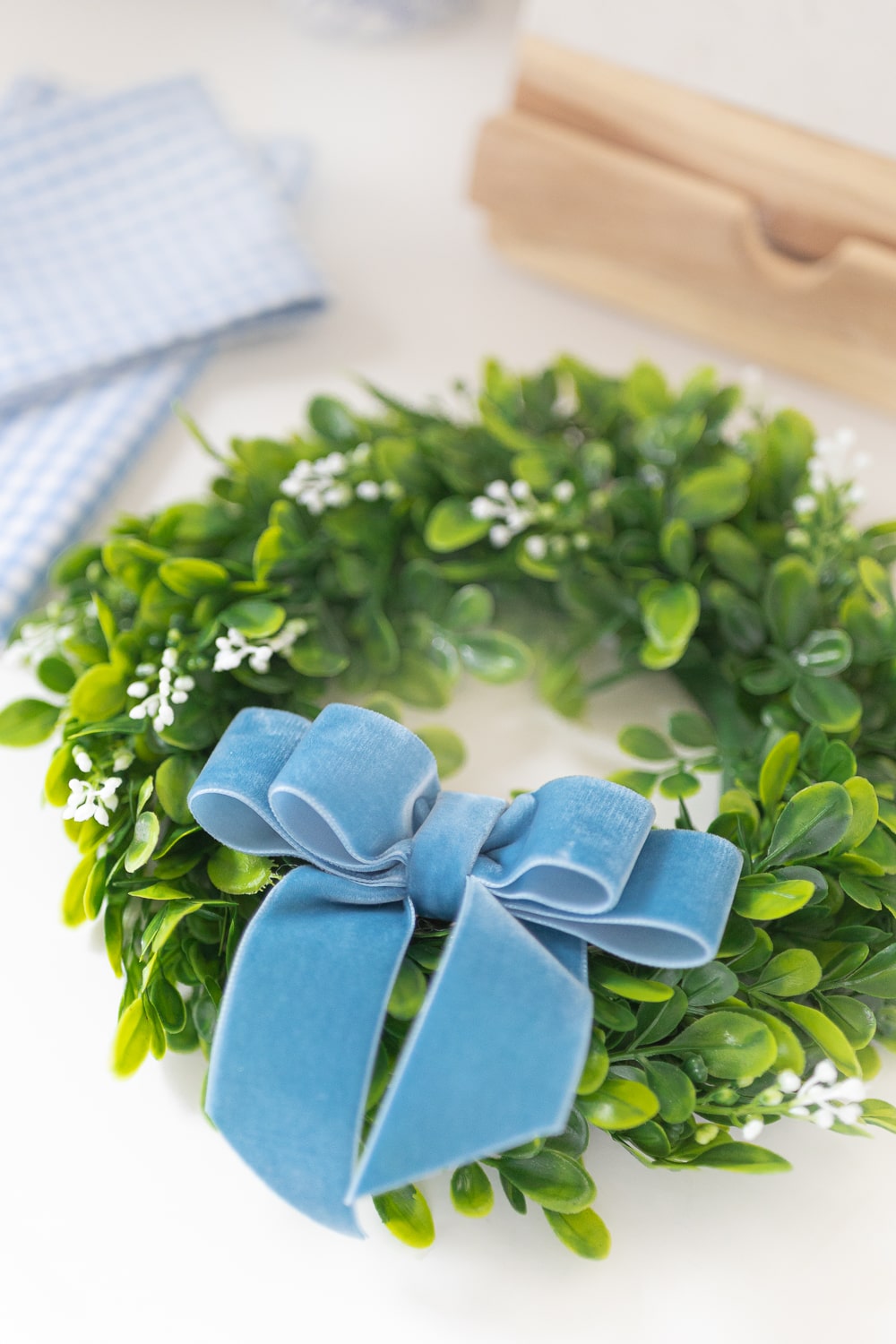 Southern lifestyle blogger Stephanie Ziajka shows how to make velvet bows for faux mini boxwood wreaths on Diary of a Debutante