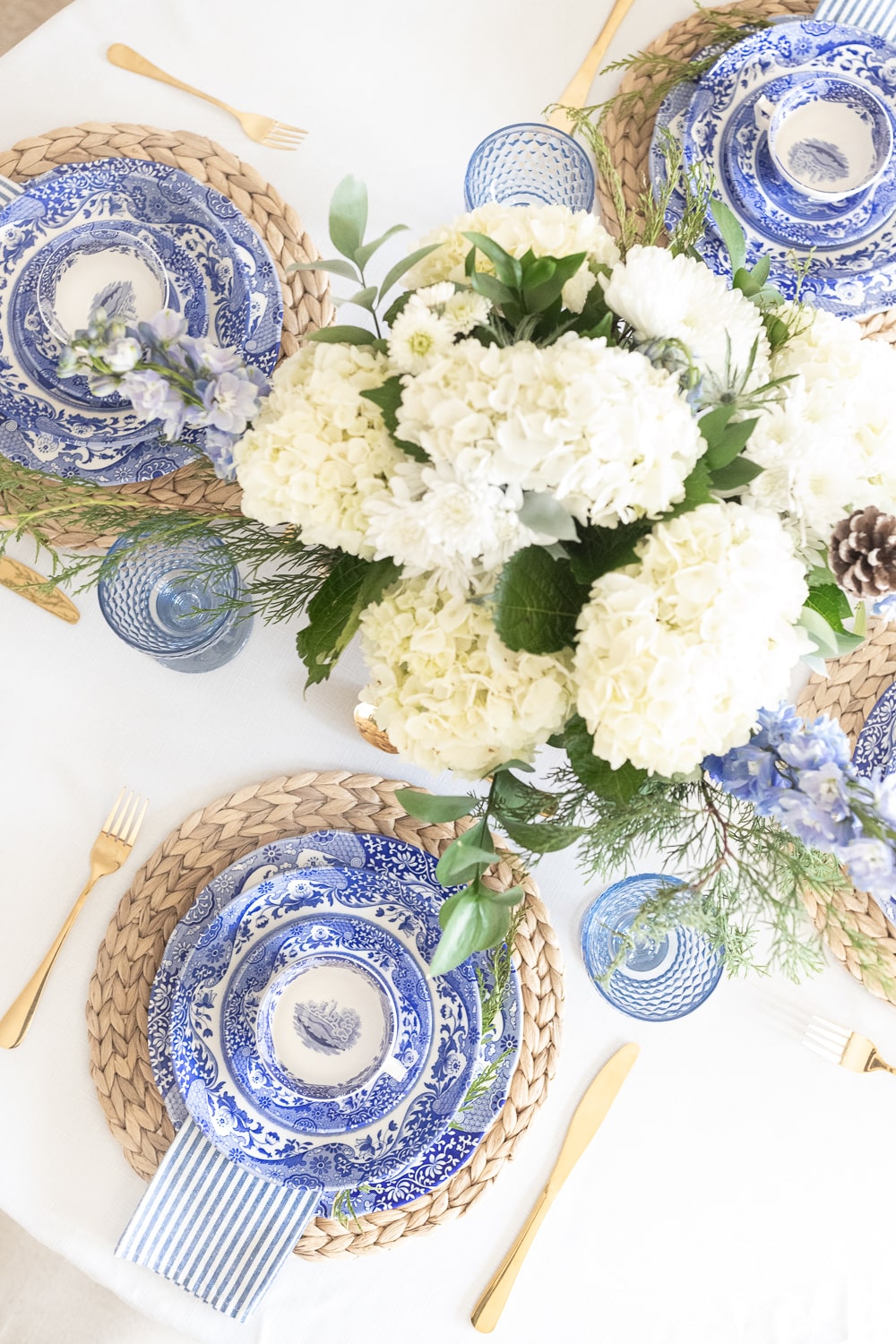Elegant blue and white winter table decor designed by southern lifestyle blogger Stephanie Ziajka on Diary of a Debutante