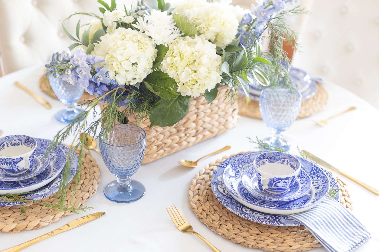 Spode blue Italian dinnerware and blue Villeroy and Boch goblets styled in a coastal winter tablescape by southern lifestyle blogger Stephanie Ziajka on Diary of a Debutante