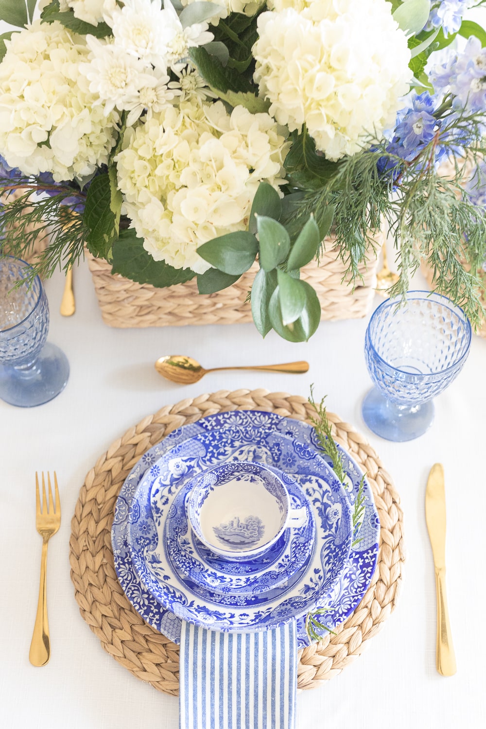 Spode blue Italian teacups, Spode blue Italian pasta bowls, and Spode blue Italian dinner plates styled in a coastal winter table setting on Diary of a Debutante